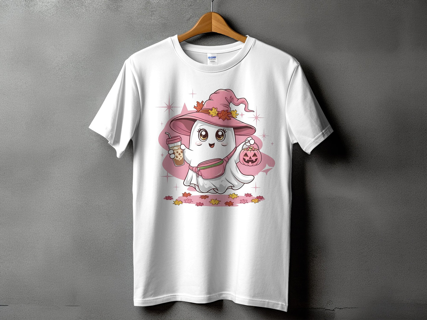 White t-shirt with a cartoon ghost wearing a pink witch hat holding a bubble tea and a pumpkin.