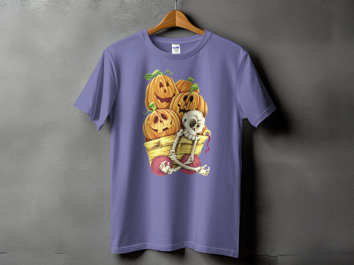 T-shirt with jack-o'-lanterns and skeleton in a cart graphic.