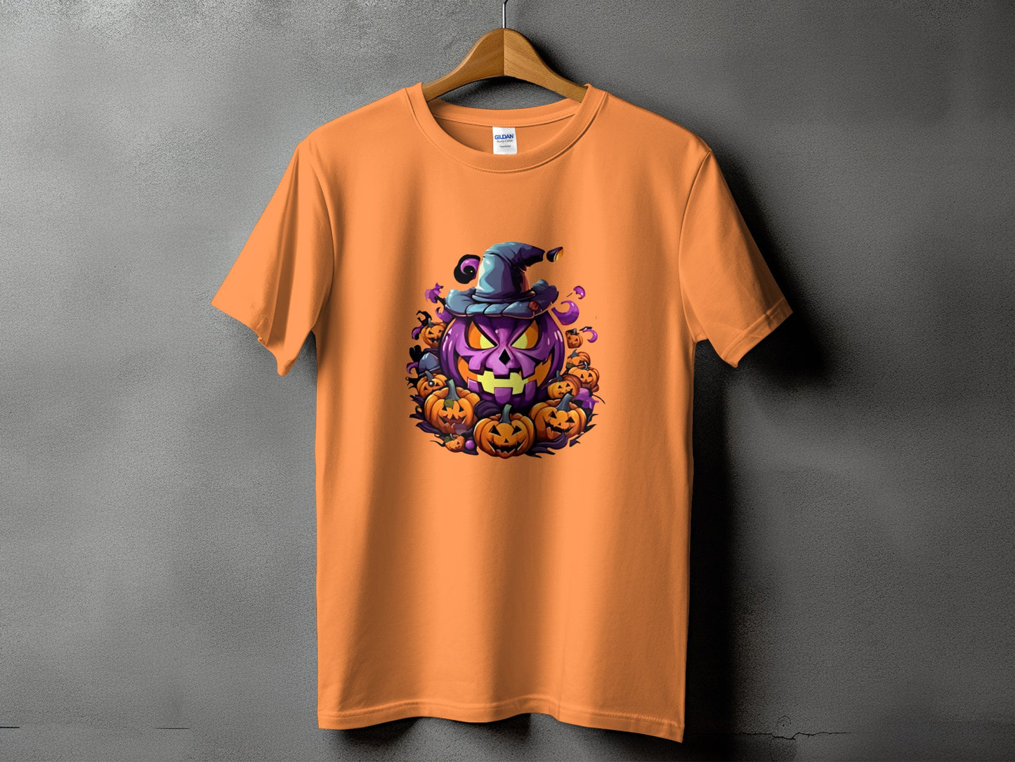 Orange t-shirt with a circular Halloween graphic of a purple jack-o-lantern.