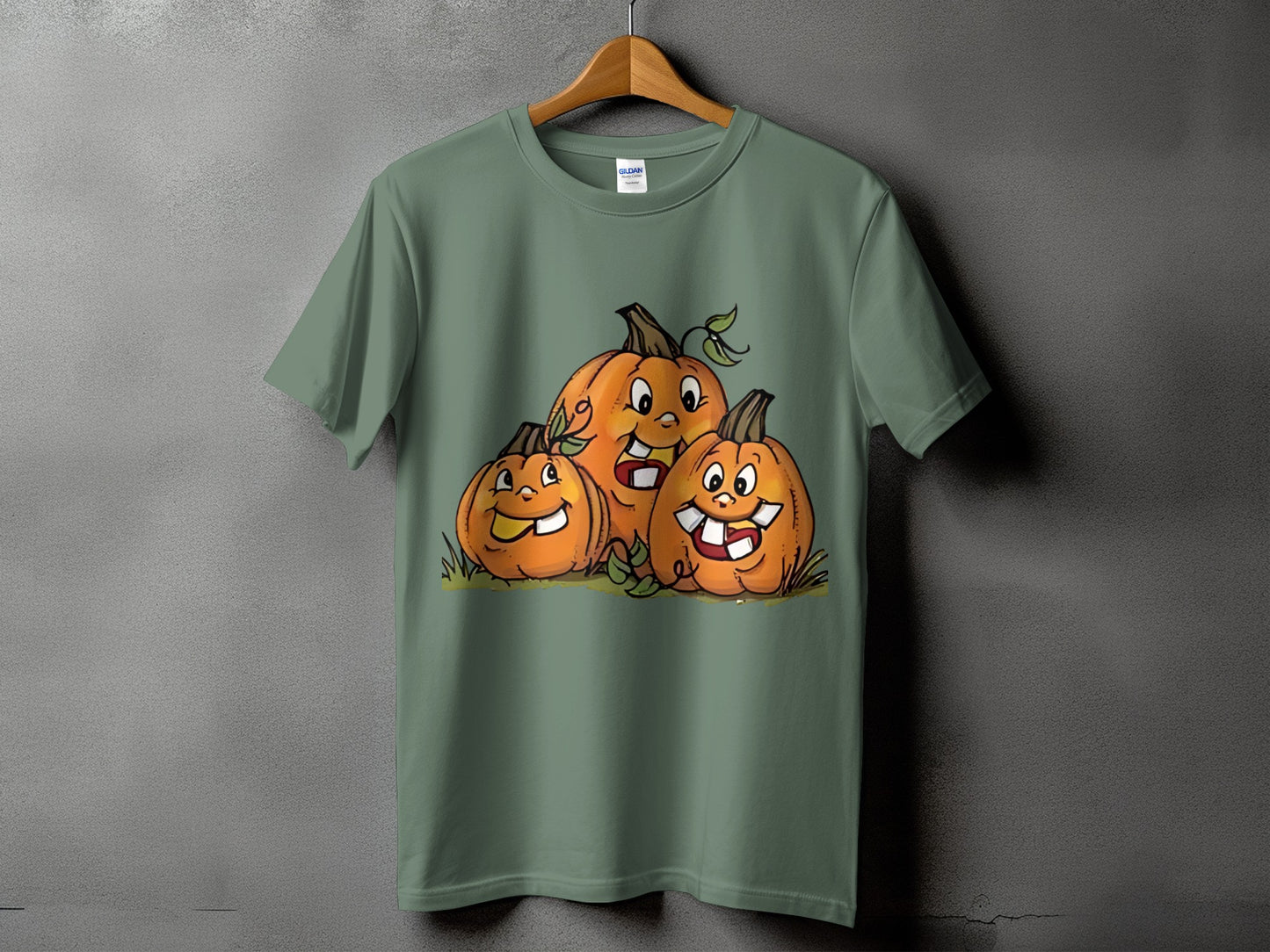 Green t-shirt with a cartoon of three smiling jack-o'-lanterns.