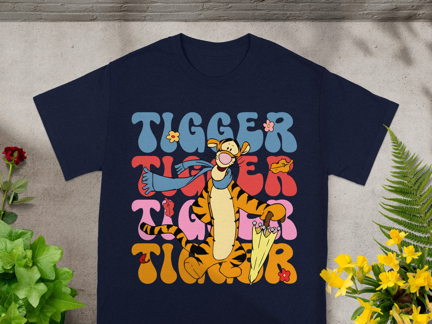 Navy t-shirt with Tigger graphics and text in groovy font.