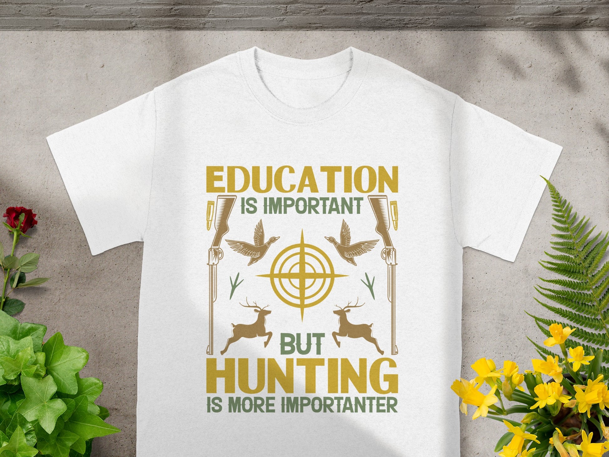 White t-shirt with text "Education is important but hunting is more importanter" and hunting graphics.