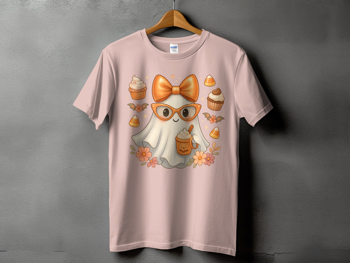 Pink t-shirt with cute ghost wearing glasses and bow, holding coffee cup.