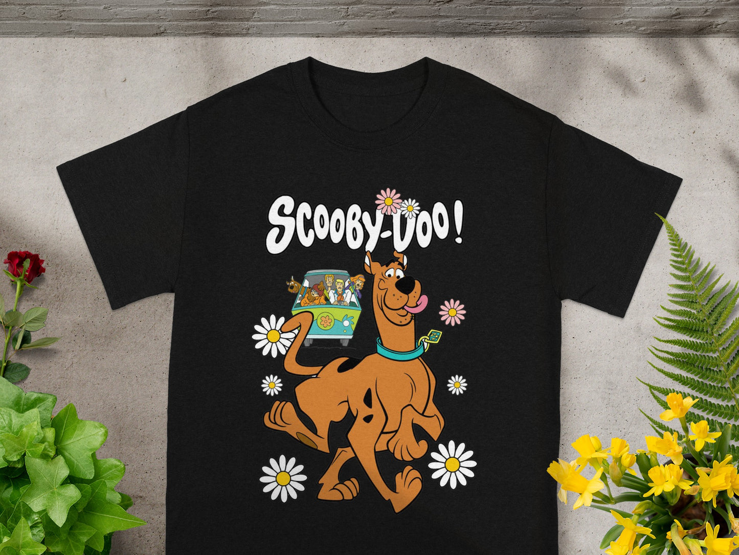 Scooby-Doo and the Mystery Machine surrounded by daisies.