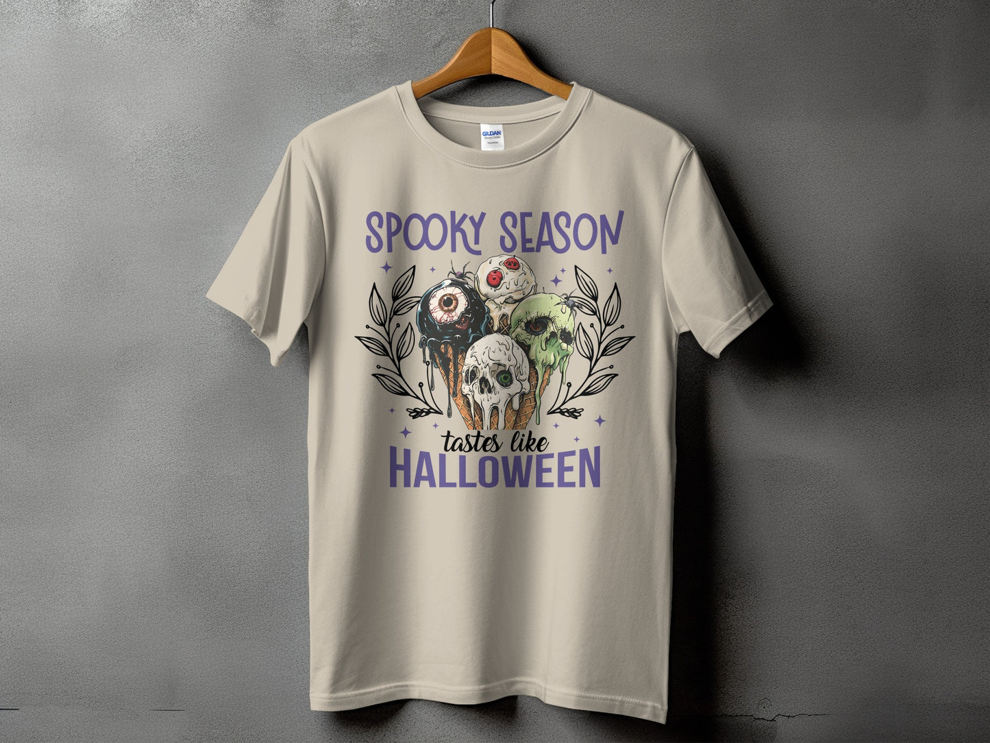 Light tan t-shirt with "Spooky Season" and Halloween-themed ice cream cones.