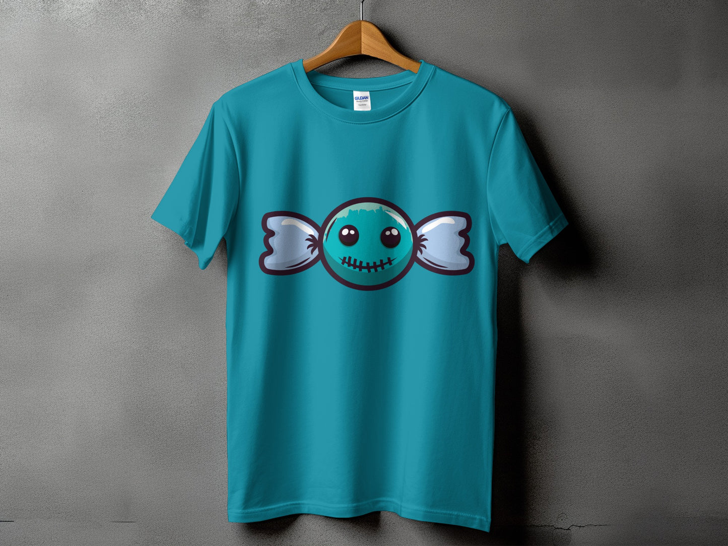 Teal t-shirt with a cartoon candy graphic featuring a smiling face.