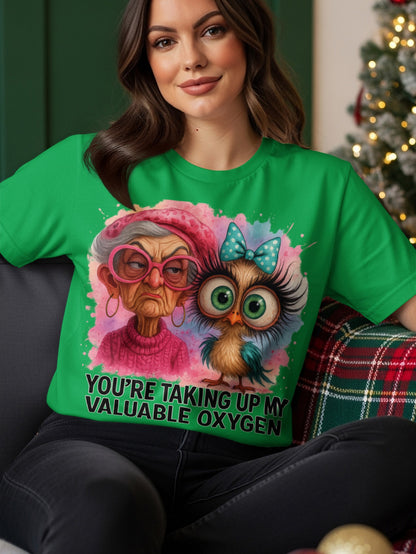 Green t-shirt with an owl and elderly woman graphic and text.