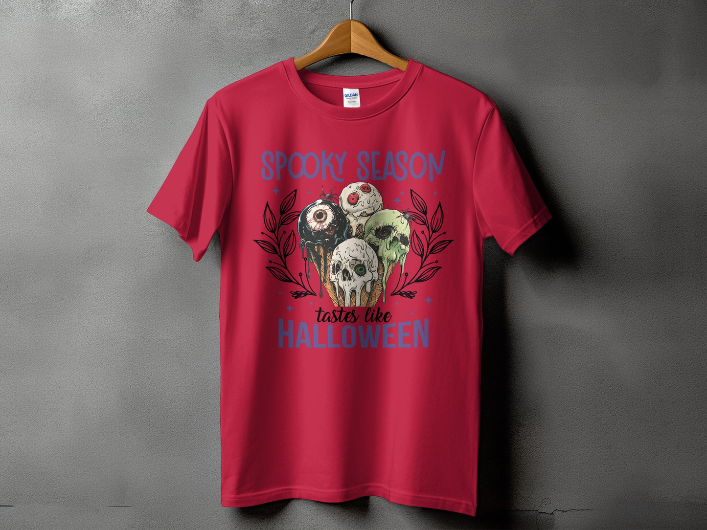 Red t-shirt with "Spooky Season tastes like Halloween" and dripping ice cream cone design.