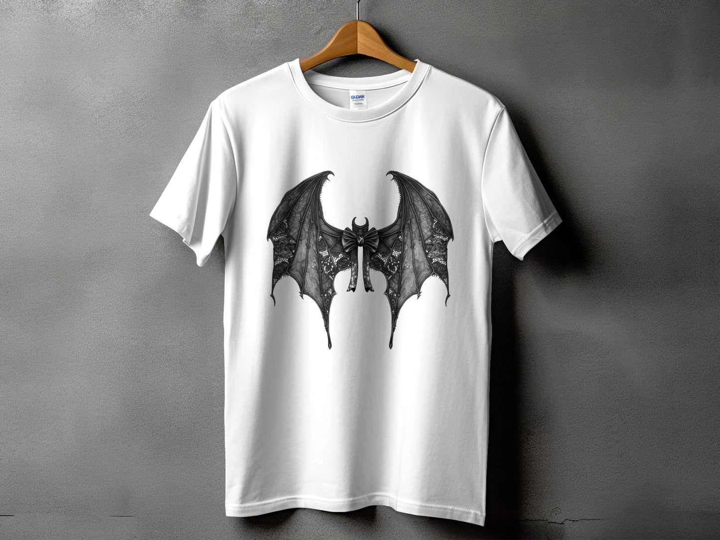 White t-shirt with a black, detailed bat wing design and bow.