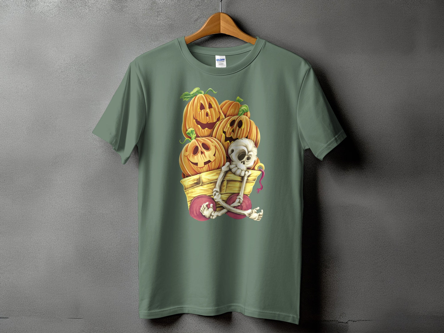 Green t-shirt with Halloween cart graphic featuring pumpkins and a skeleton.