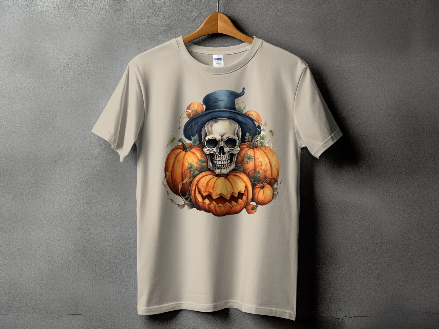 Skull and pumpkins Halloween graphic on a tan t-shirt.