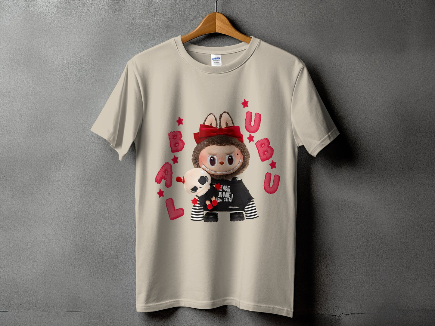 Tan t-shirt with a character wearing a black shirt with "BEARE THE MONSTERS!" text.