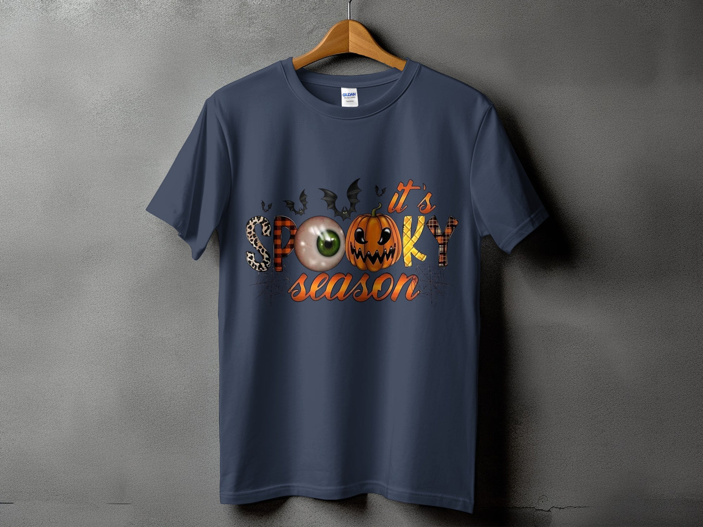 Dark blue t-shirt with "it's SPOOKY season" text and Halloween graphics.