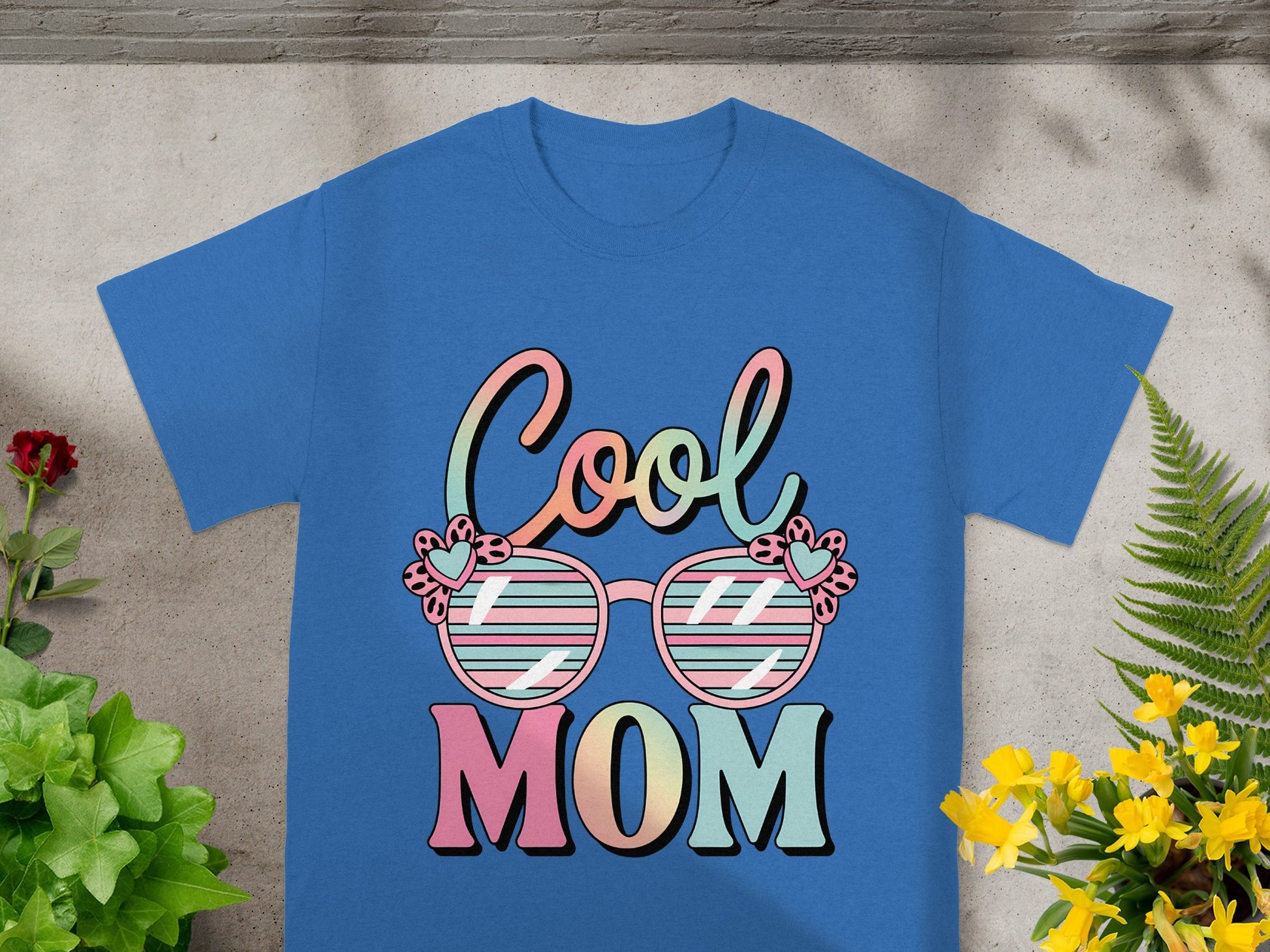 Blue t-shirt with "Cool Mom" text and sunglasses graphic.