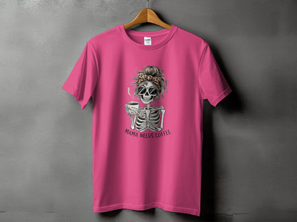 Pink t-shirt with skeleton graphic and "Mama Needs Coffee" text.