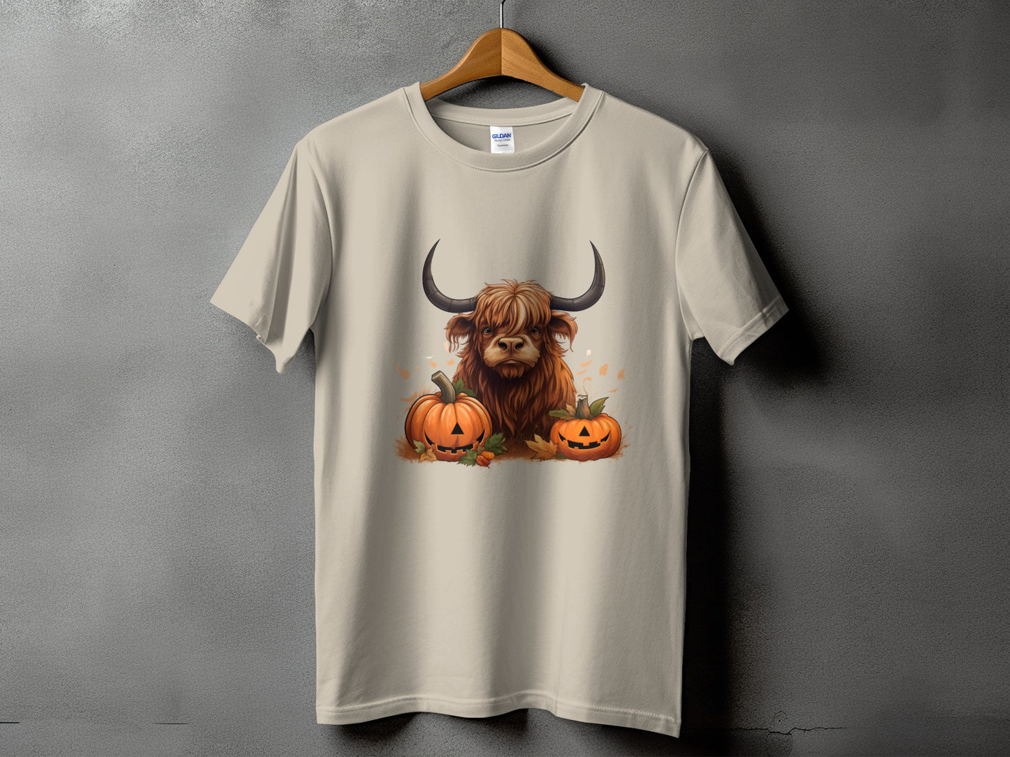 T-shirt with Highland cow and jack-o'-lantern Halloween graphic.