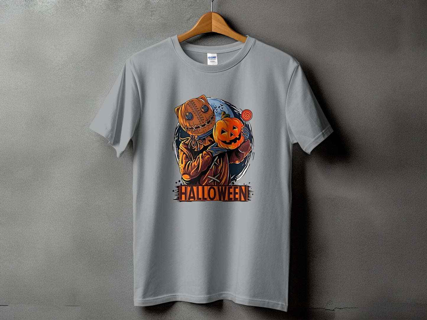 Gray t-shirt with a Halloween character holding a pumpkin and a lollipop.