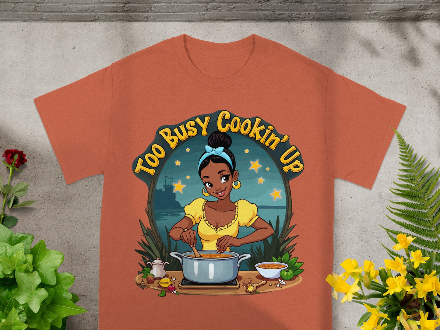 "Too Busy Cookin' Up" text above a smiling woman cooking in a pot.