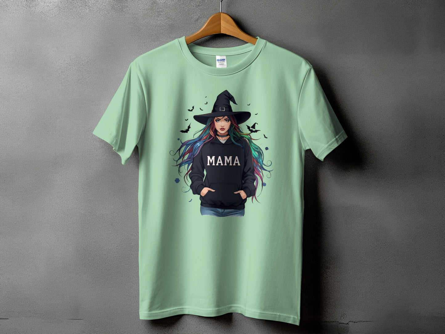 Light green t-shirt with "MAMA" text and a witch graphic.