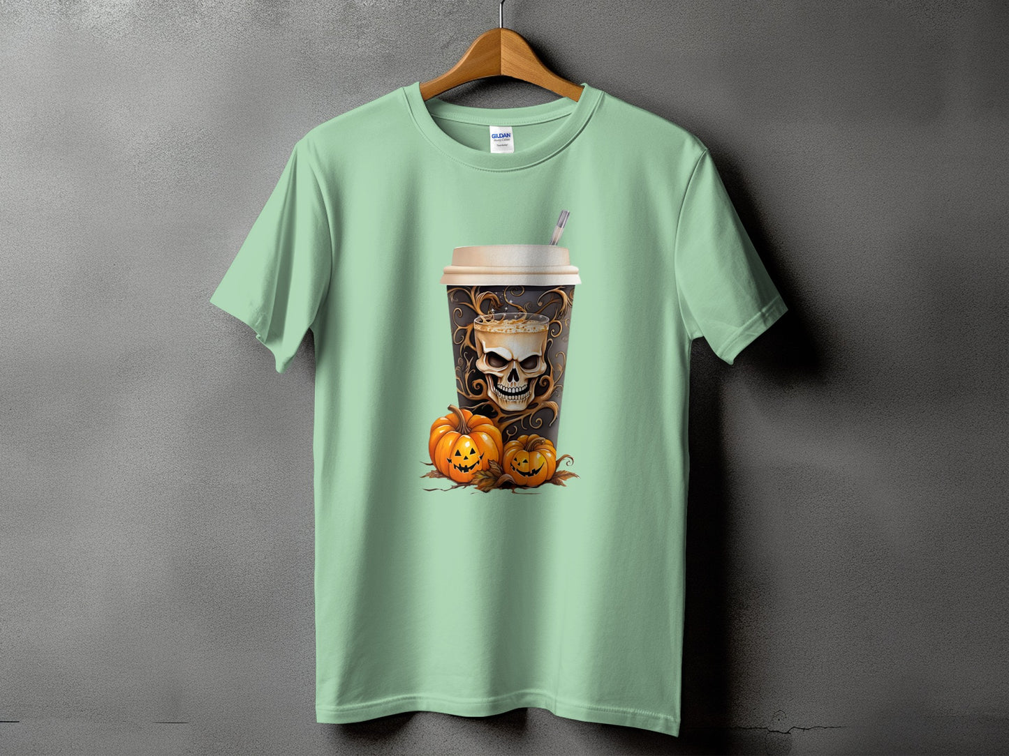 Light green t-shirt with a skull-themed coffee cup and jack-o'-lanterns graphic.