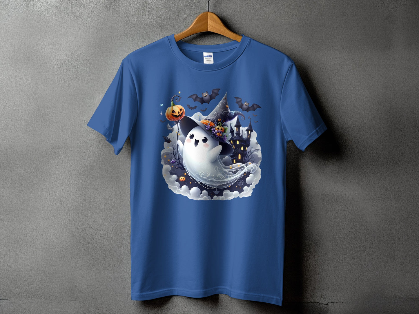 Blue t-shirt with a cute ghost character, pumpkin, bats, and a haunted castle graphic.