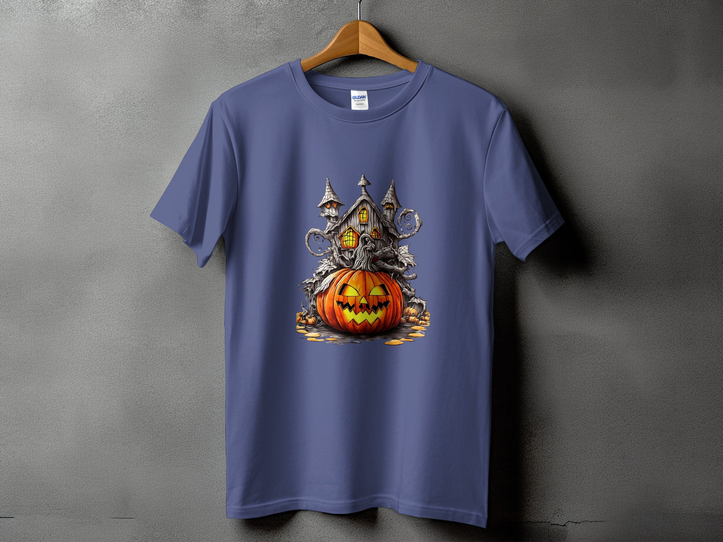 T-shirt with a Halloween haunted house graphic and a carved jack-o'-lantern.
