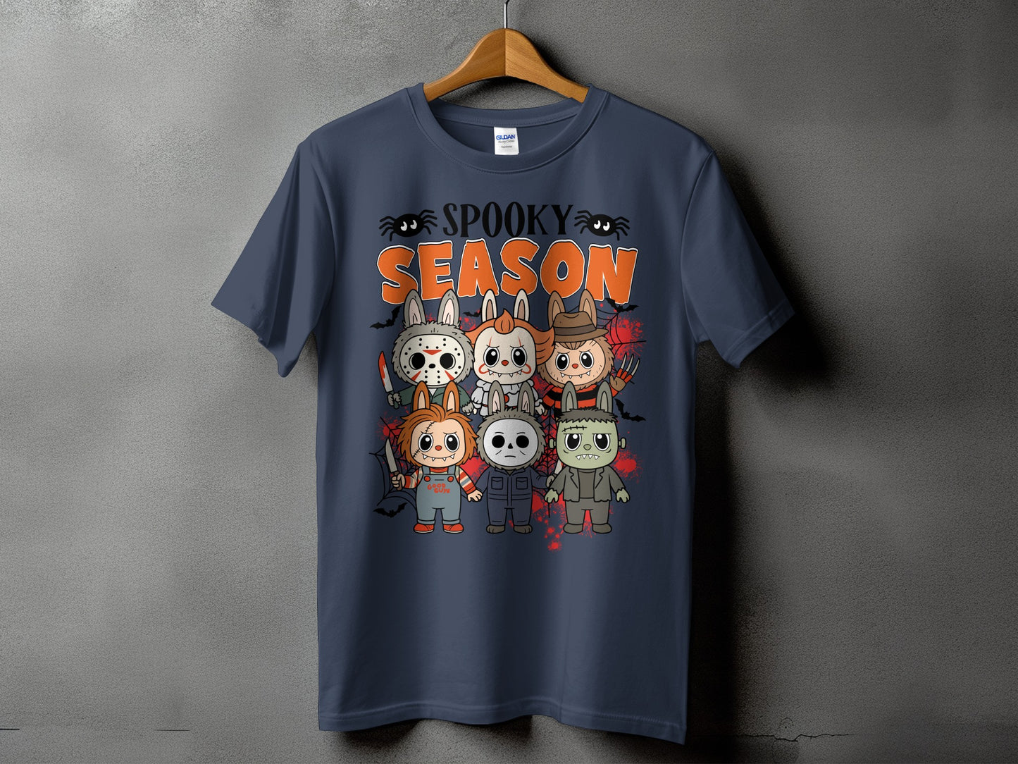 Dark blue t-shirt with "Spooky Season" text and cartoon horror characters.