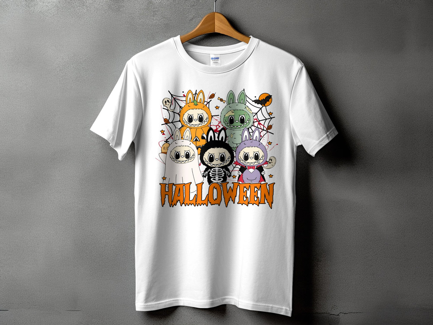 White t-shirt featuring cartoon Halloween characters and "HALLOWEEN" text.
