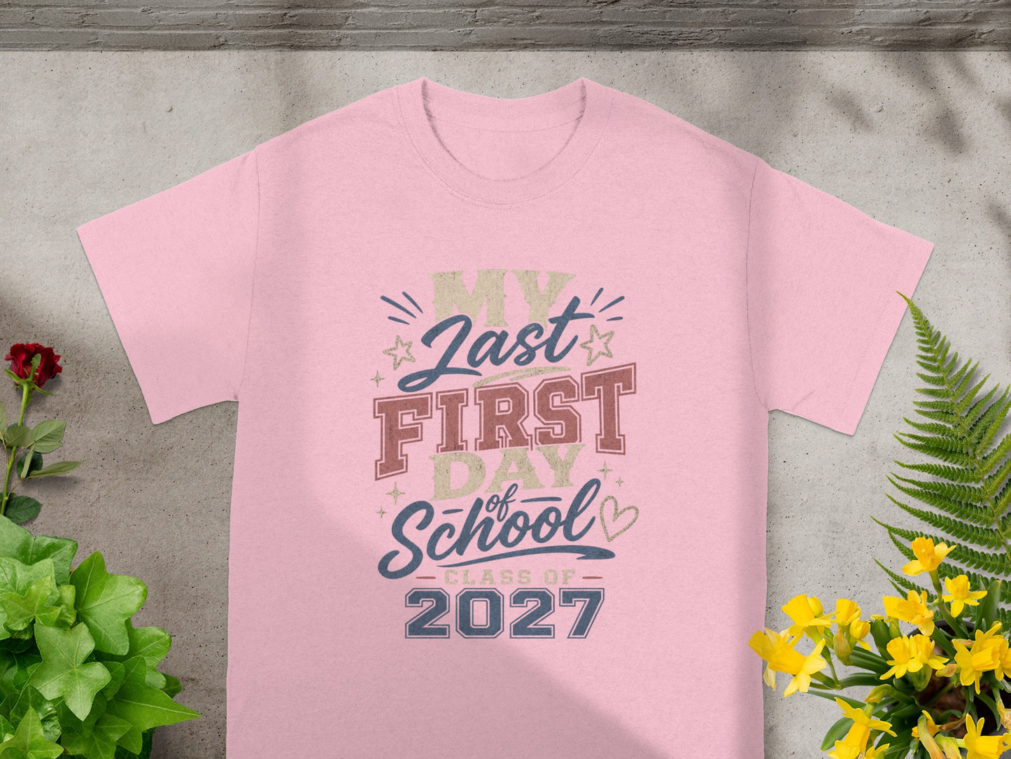Pink t-shirt with text "My Last First Day of School - Class of 2027".