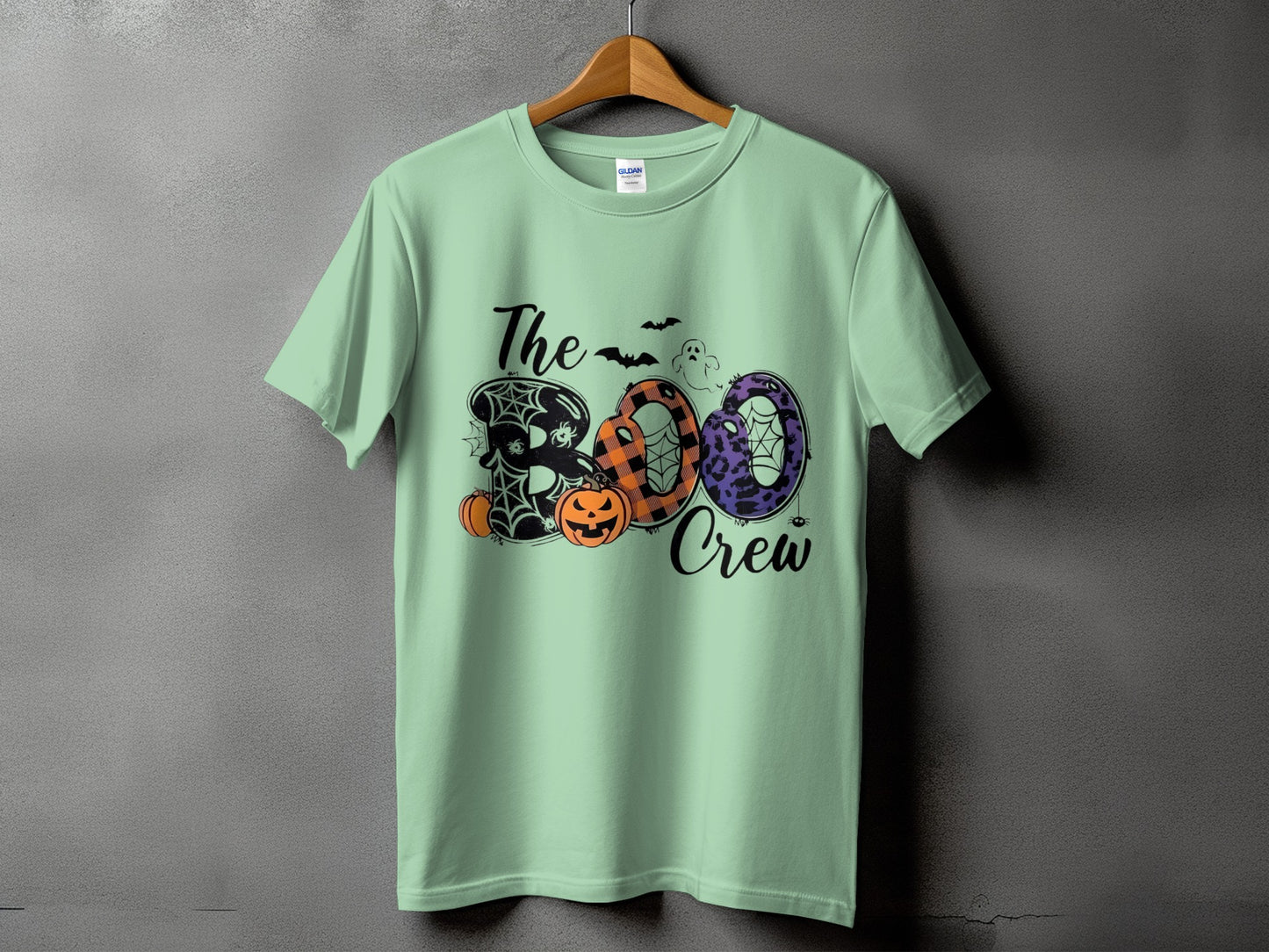 Green t-shirt with "The Boo Crew" Halloween graphic featuring pumpkins and spiders.