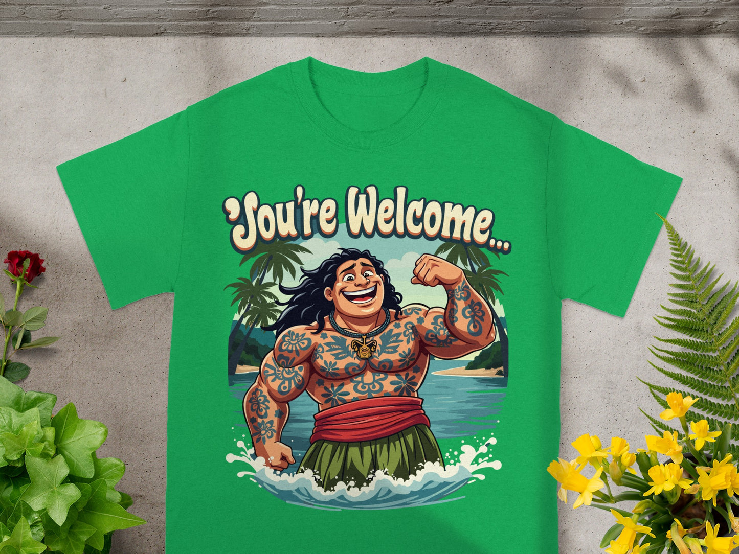 Green t-shirt with cartoon Maui flexing and text "You're Welcome".