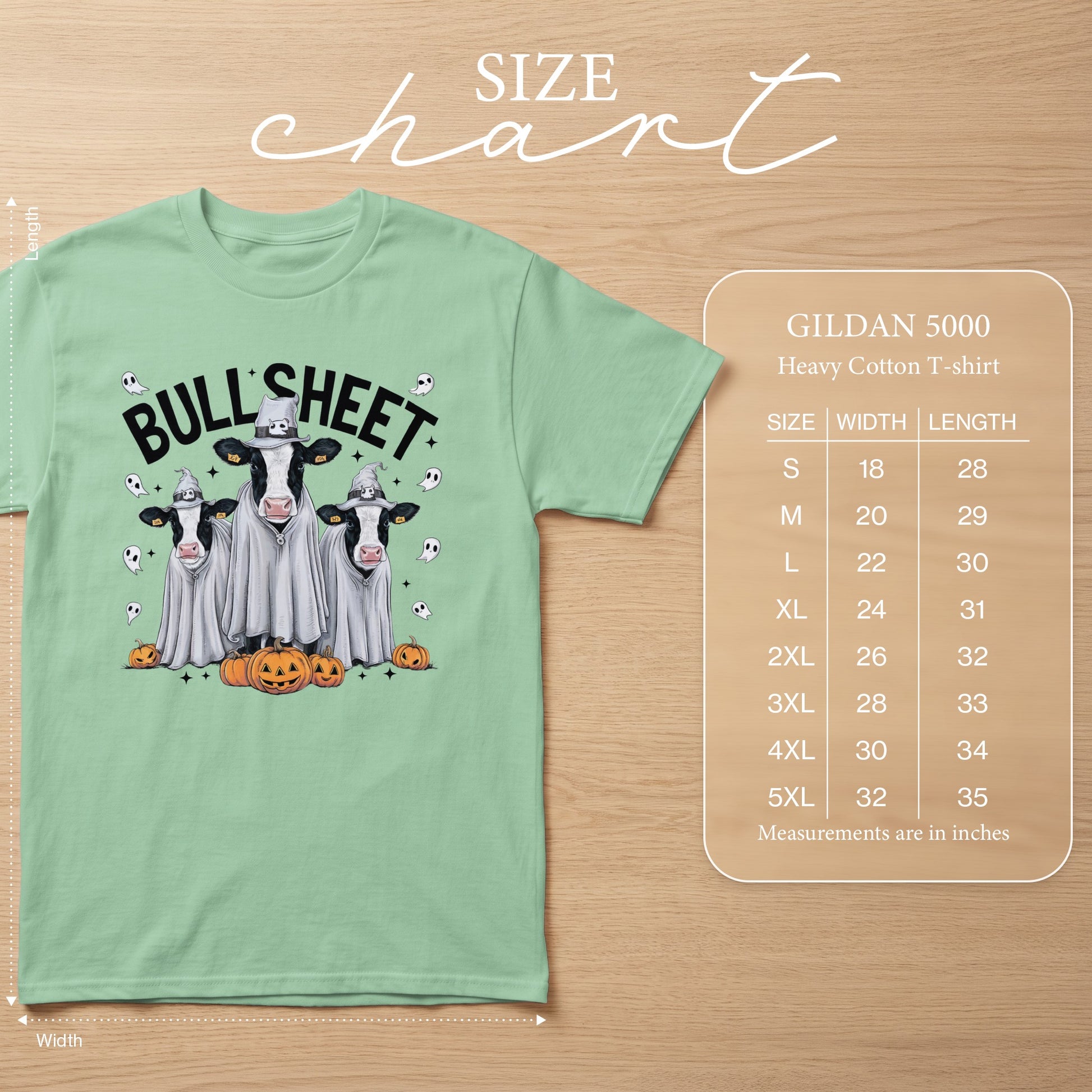 Gildan 5000 t-shirt with ghost cows and pumpkins graphic, size chart.