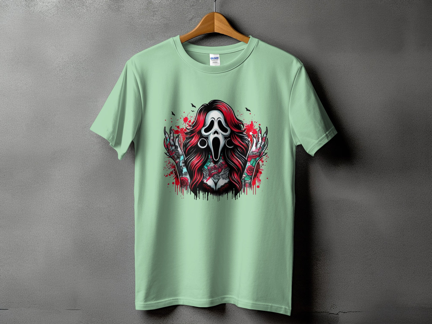 Mint t-shirt with ghost face, red hair, and tattooed arms with roses.