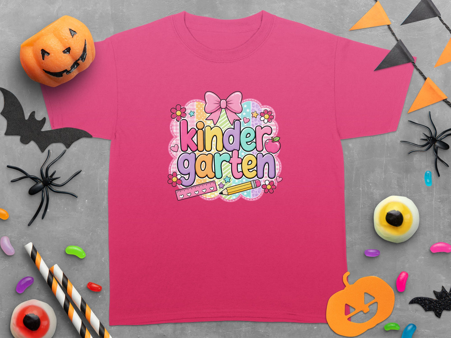 Fuchsia t-shirt features "kindergarten" text with school and Halloween motifs.