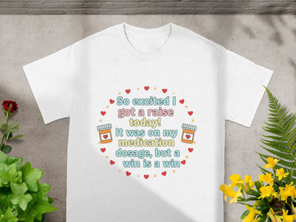 White t-shirt with text about a medication dosage raise and win.