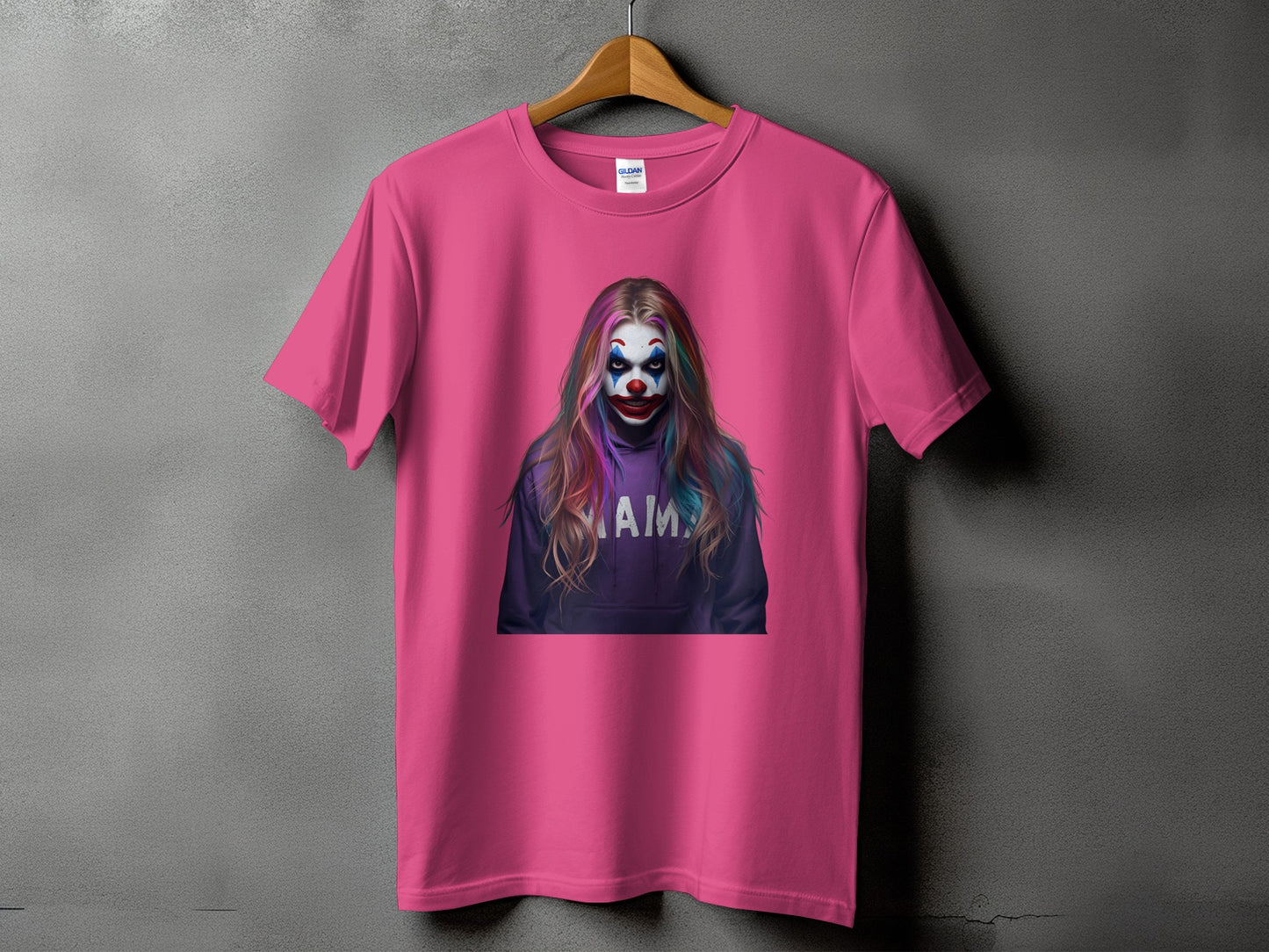 Pink t-shirt with a graphic of a clown wearing a purple hoodie with "MAMA" text.