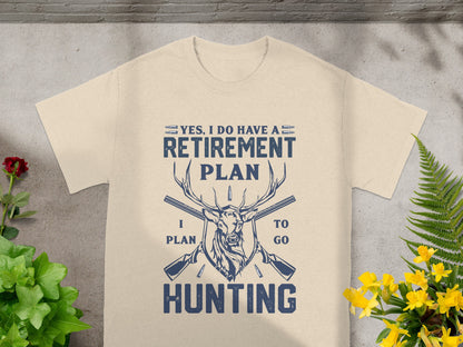 Tan t-shirt with deer, guns, and text: "Yes, I do have a retirement plan I plan to go hunting."
