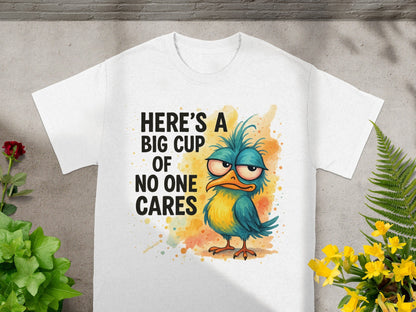 White t-shirt with a grumpy bird graphic and "Here's a big cup of no one cares" text.