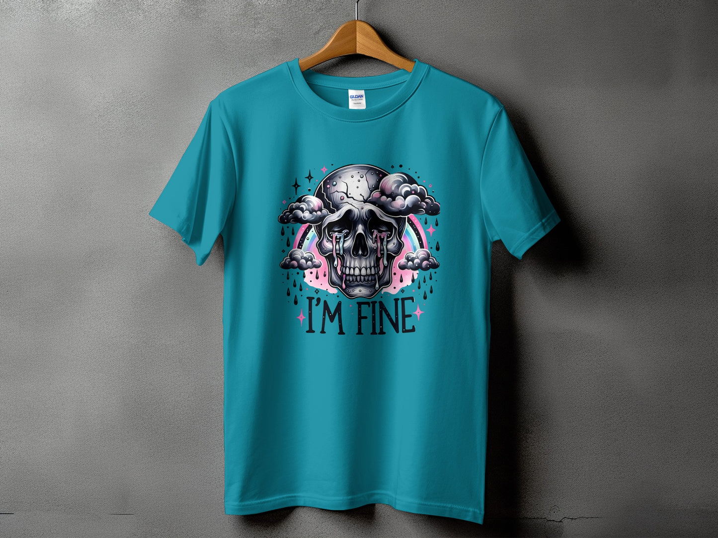 Teal t-shirt with a crying skull graphic and the text "I'M FINE".