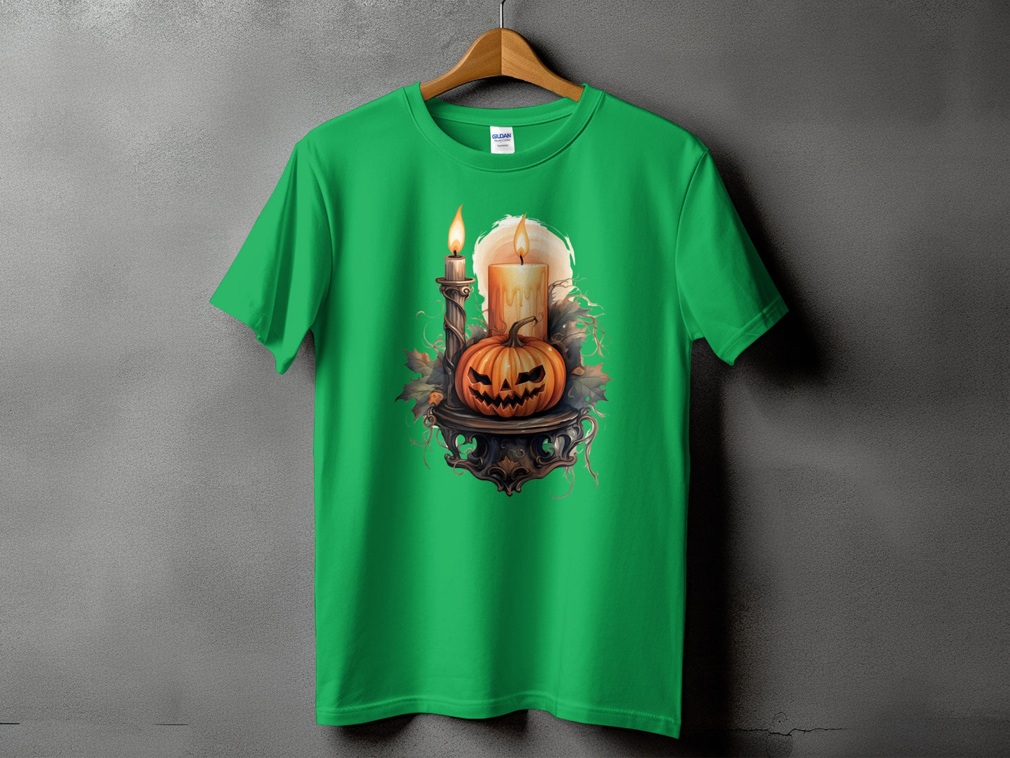 Green t-shirt with a spooky jack-o'-lantern and two lit candles design.