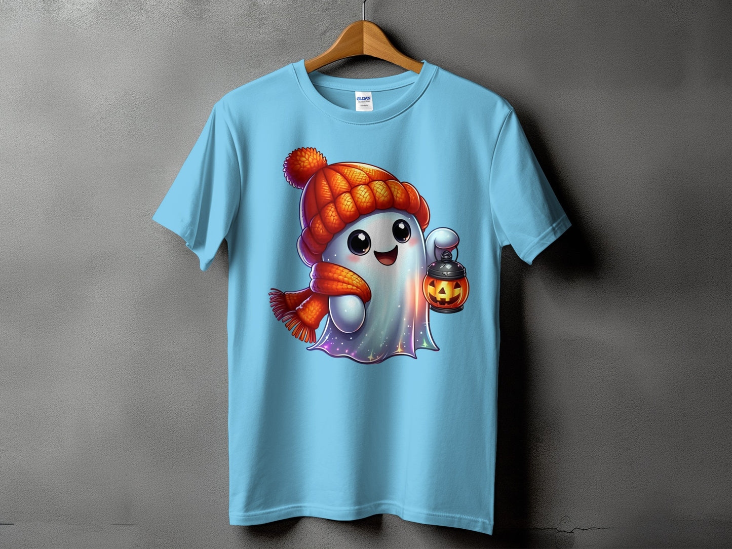 Light blue t-shirt featuring a cute ghost with a pumpkin lantern.