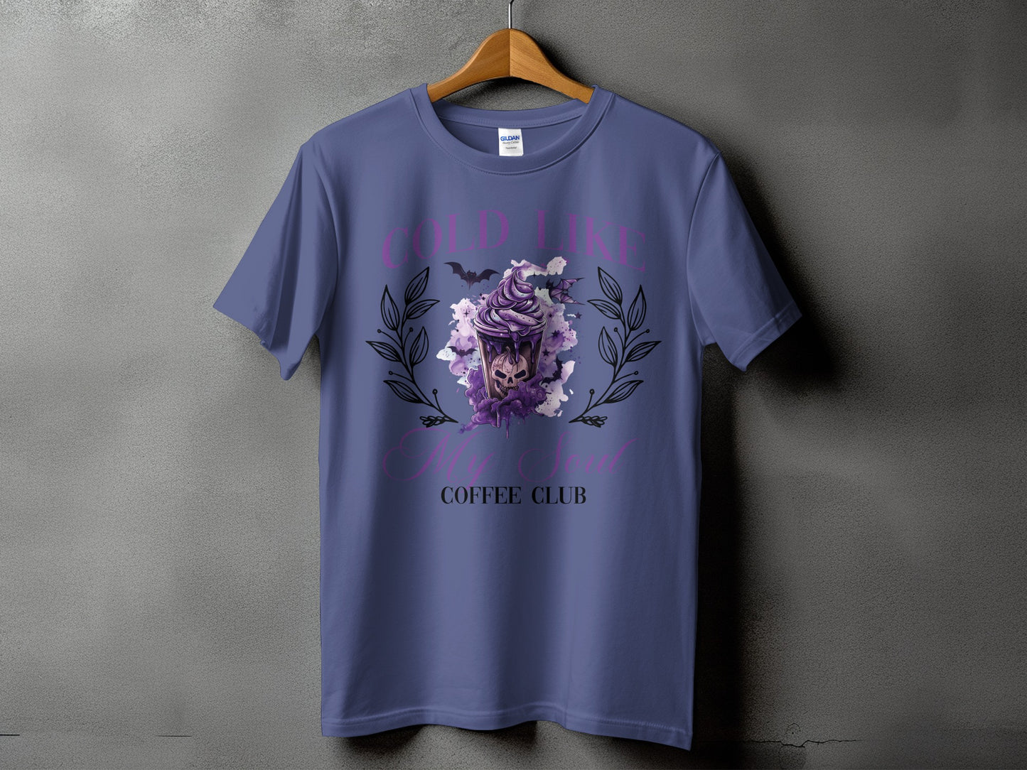 Purple t-shirt with "COLD LIKE MY SOUL COFFEE CLUB" text and skull coffee cup graphic.