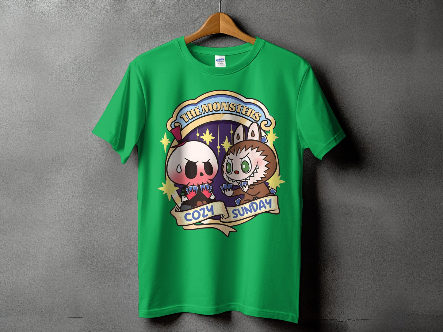 Green t-shirt with "The Monsters Cozy Sunday" graphic featuring cartoon characters playing cards.