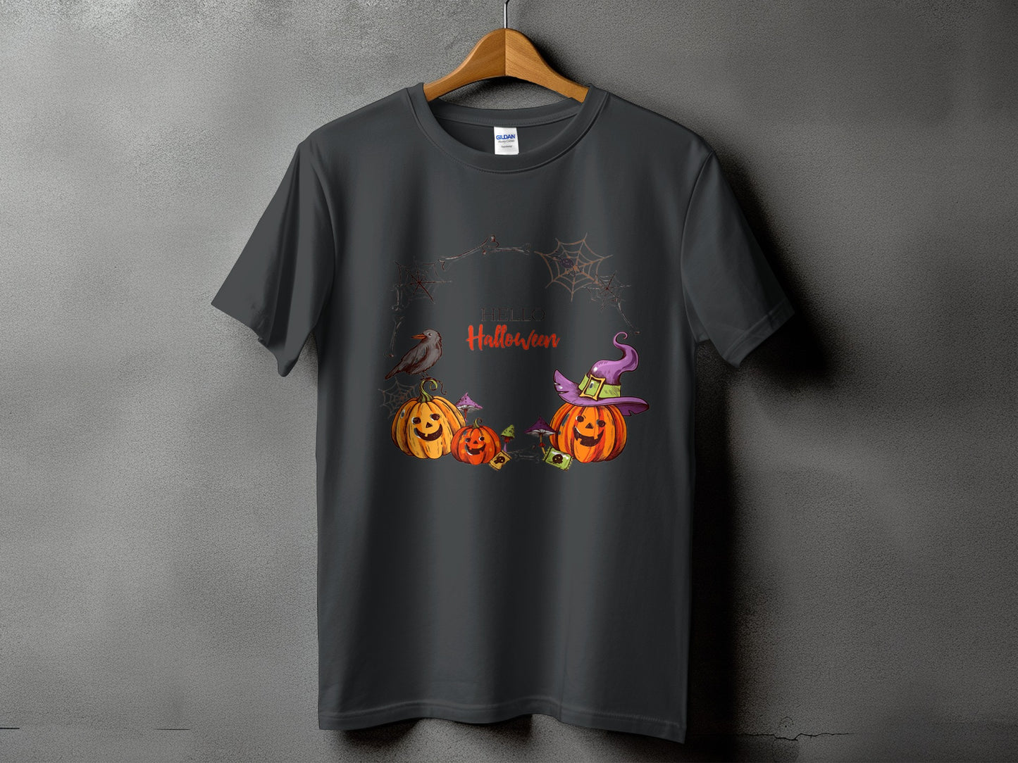 Dark grey t-shirt with "Hello Halloween" text, pumpkins, a bird, and witch hat graphic.