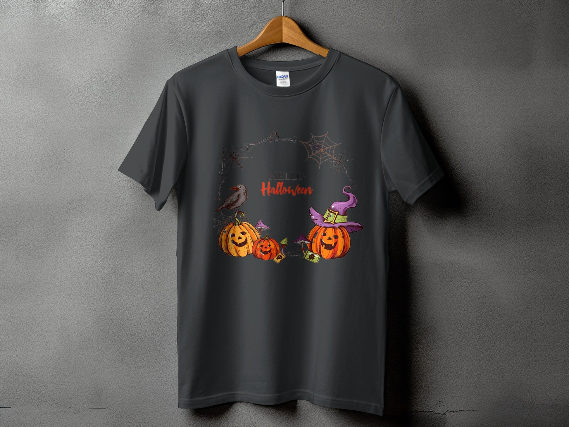 Dark grey t-shirt with "Hello Halloween" text, pumpkins, a bird, and witch hat graphic.