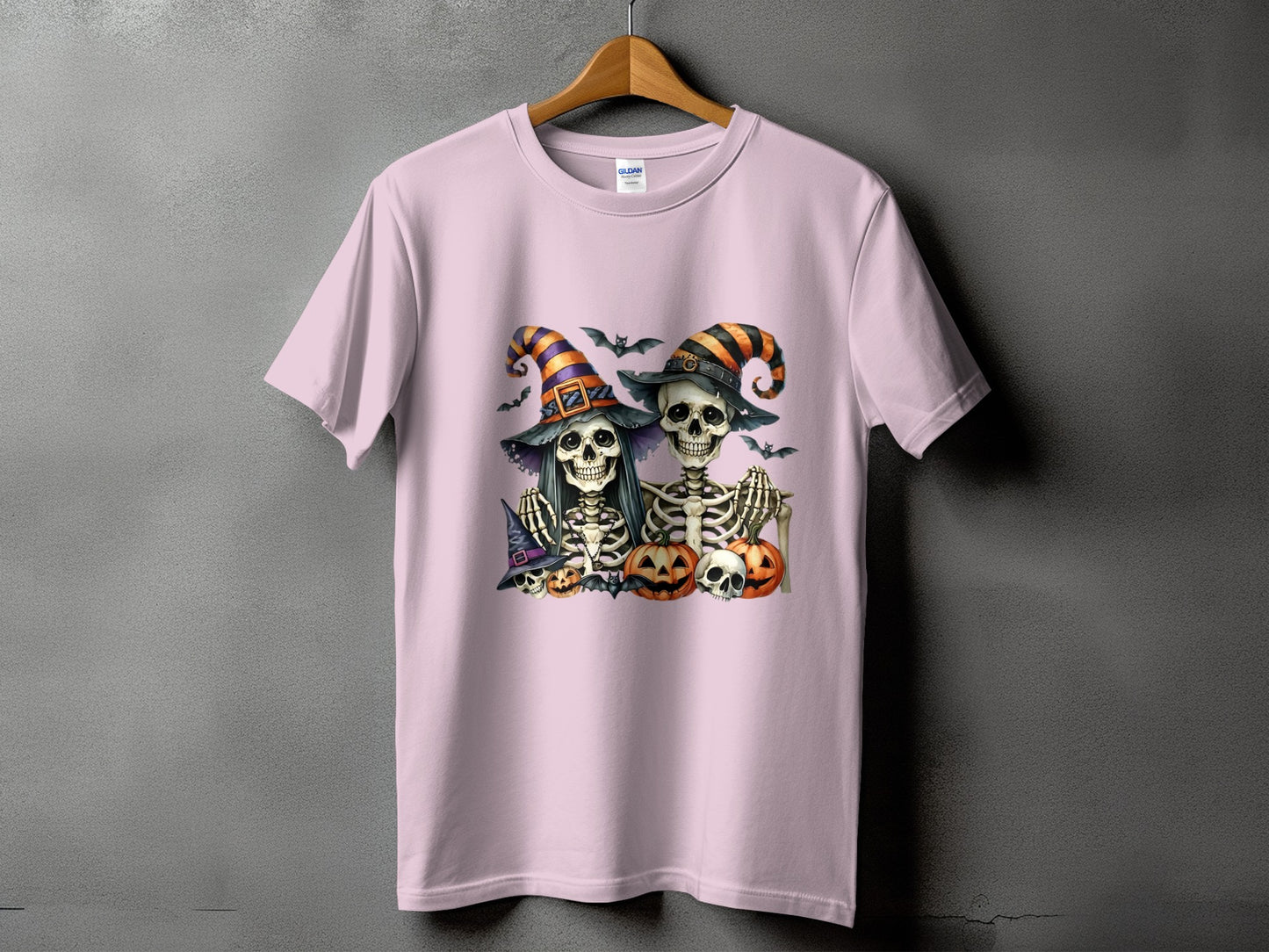 Two skeletons in Halloween witch hats with pumpkins and bats.