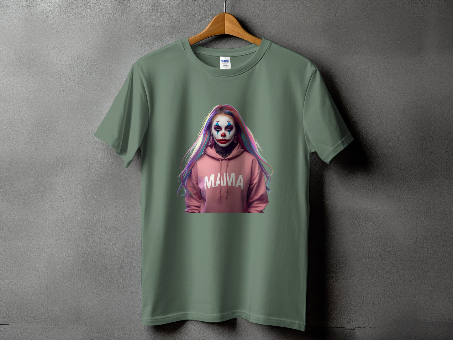 Green t-shirt with a graphic of a clown face on a pink hoodie, text reads "MAMA".