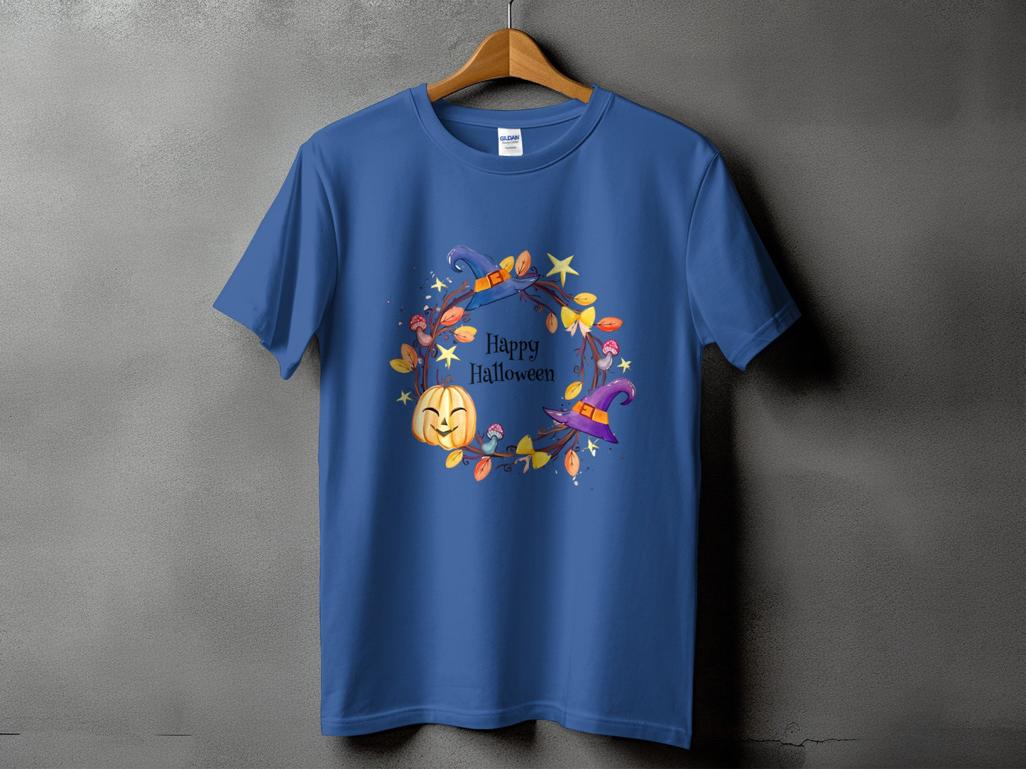 Blue t-shirt with a circular Halloween graphic featuring a pumpkin and witch hat.