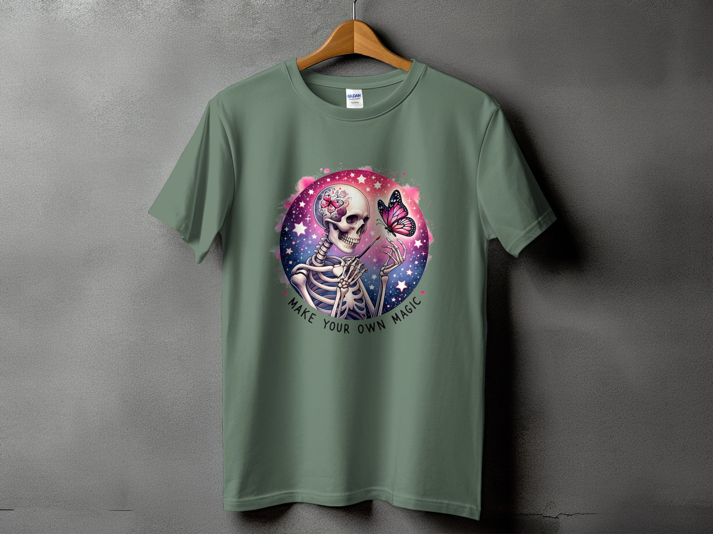 T-shirt with skeleton, butterfly, stars, and text "Make Your Own Magic."
