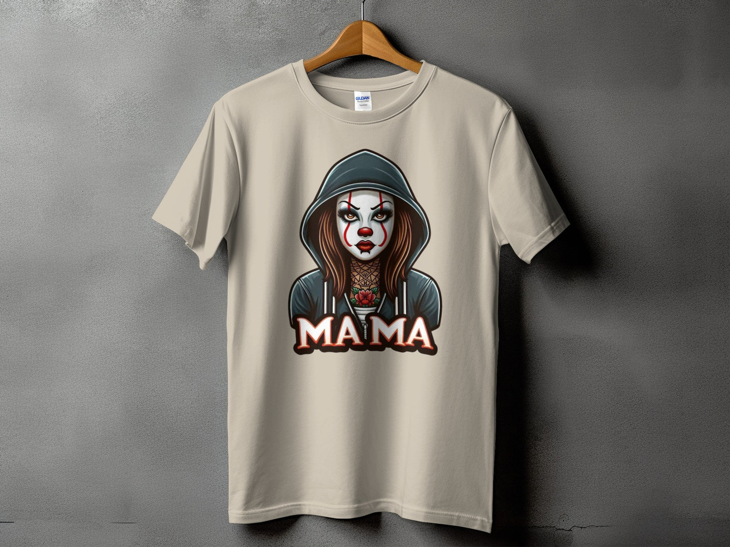 Tan t-shirt with a graphic of a stylized clown with the word "MAMA".